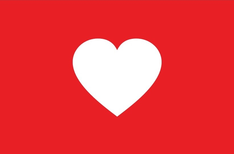 Purina bryr sig om våra samhällen logotyp med vitt hjärta på röd bakgrund